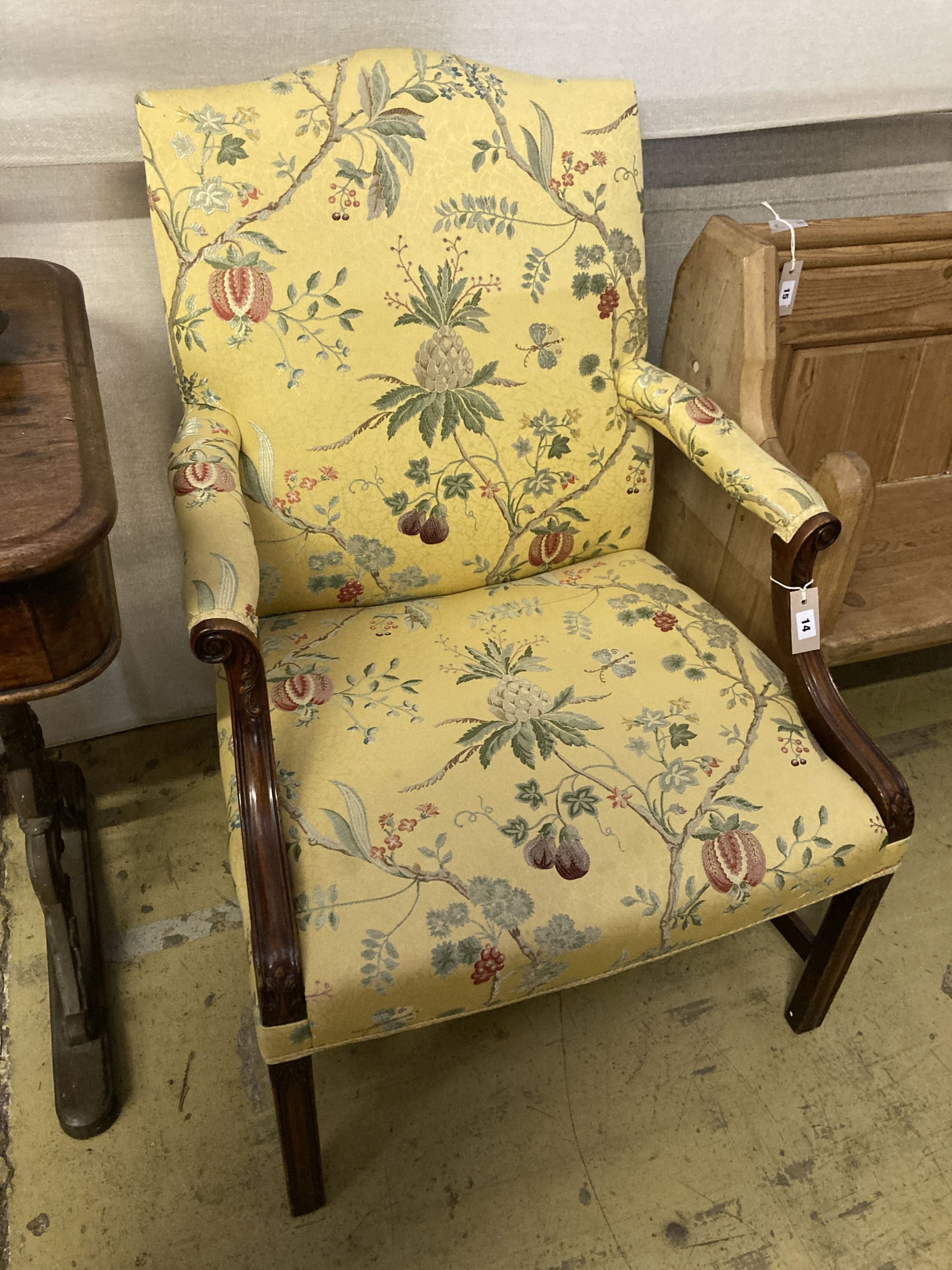 A George III style mahogany Gainsborough armchair, upholstered in a yellow ground fabric, width 68cm, depth 76cm, height 98cm